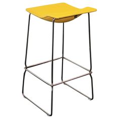 a yellow stool sitting on top of a metal frame