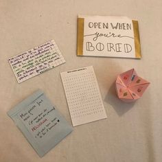 an origami fortune teller and other items on a table