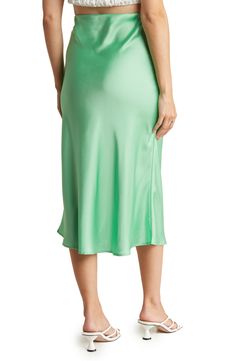 Elevate your wardrobe with this pull-on bias satin midi skirt for elegant, feminine style. 31" length (size S) Elasticized waist Pull-on style Satin construction 97% polyester, 3% spandex Machine wash cold, line dry Made in USA Model’s stats for sizing: 5’10” height, 34” bust, 27” waist, 35” hips. Model is wearing size S. Spring Satin Relaxed Fit Skirt, Spring Satin Midi Bottoms, Summer Satin Midi Bottoms, Satin Midi-length Bottoms For Spring, Silk Midi Skirt For Spring, Chic Satin Knee-length Bottoms, Chic Knee-length Satin Bottoms, Satin Midi Skirt For Summer, Satin Flared Skirt For Spring