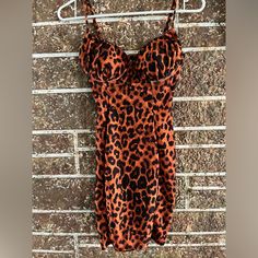 Never Worn Cheetah Print Mini Dress Fitted Tiger Print Mini Dress, Fitted Sleeveless Mini Dress With Tiger Print, Fitted Sleeveless Tiger Print Mini Dress, Fitted Tiger Print Mini Dress For Summer, Fitted Black Dress With Tiger Print, Printed Mini Dress, Black Orange, Cheetah Print, Orange Black