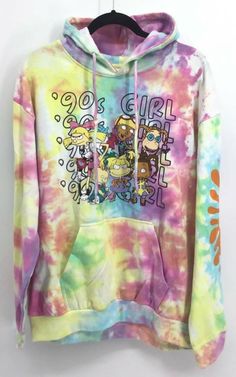 Nickelodeon Hoodie Sweatshirt  Description A women's hoodie sweatshirt from Nickelodeon with 90's girls theme with Rugrats and Hey Arnold.  The hoodie is in pink, yellow, blue, green, white, and purple with a tie dye pattern.  The hoodie has a kangaroo pocket front, long sleeves, and the sweater shirt is new with tags. Size  Large   B8 Color of clothing may slightly vary due to photographic lighting sources or your monitor settings.   OUR COMBINE SHIP RATE Highest ship cost and each additional i Rugrats Sweater, 90s Girl, Hey Arnold, Women's Hoodie, Tie Dye Pattern, Tie Dye Patterns, Women Hoodies Sweatshirts, Baddie Outfits, Photographic Lighting