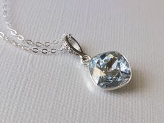 Dusty Blue Pastel Blue Shade Crystal Silver Square Pendant Necklace with .925 Sterling Silver Chain. PLEASE READ ITEM DESCRIPTION and SHOP POLICIES before placing your order, and contact me with any questions! CHAIN is 18 inches (45.7 cm) long, PENDANT is about 1 inch (2.5cm) long including bail. NECKLACES SECTION: https://www.etsy.com/shop/LanaChayka?ref=simple-shop-header-name&listing_id=880970583§ion_id=17026331&sort_order=date_desc BRIDAL NECKLACES SECTION: https://www.etsy.com/shop/LanaChay Elegant Light Blue Necklace For Wedding, Elegant Light Blue Wedding Necklaces, Aquamarine Pendant Jewelry For Wedding, Aquamarine Light Blue Necklace For Anniversary, Blue Aquamarine Wedding Jewelry, Blue Aquamarine Pendant Necklace, Bridal Necklaces, Square Pendant Necklace, Bridal Pendant