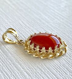 "Large Untreated Mediterranean Red Coral, 14k Yellow Gold Handcrafted Pendant, New* This beautiful pendant has a classic design and features an 10mmx12mm (3.5 ctw), oval, Mediterranean (corralium rubrum) red coral cabochon. This pendant has been handcrafted by our jeweler from solid 14k yellow gold and genuine, untreated, Italian coral. The piece has a quality mark on the bail. This pendant measures 1.04\"x 0.58\" and weighs 2.65 grams. * This pendant will ship in a gift box. * Newly handcrafted Bridal Diamond Jewellery, Coral Pendant, Watermelon Tourmaline, Oval Pendant, Diamond Jewellery, Pandora Bracelet, Gold Jewelry Fashion, Handmade Fashion, Red Coral