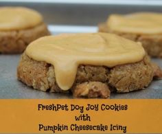 three cookies with frosting on top and the words, fresh - pet dog joy cookies with pumpkin cheesecake icing