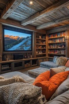 a living room filled with furniture and a flat screen tv mounted to the side of a wall