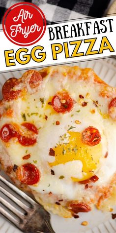 an egg pizza on a plate with a fork