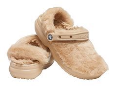 Crocs Classic Fur Sure - Women's Shoes : Chai : The legendary Classic Clog, now with faux-fur fuzz inside and out. Great indoors or out. Incredibly light and easy to wear with slippers-like comfort. Slip-on sandal with classic Crocs oblique toe silhouette. Faux fur lining. Pivoting heel straps for a more secure fit. Customizable backstrap for Jibbitz charms. Dual Crocs Comfort: Blissfully supportive. Soft. Cradling comfort. Easy to clean and quick to dry. Imported. Weight of footwear is based on Crocs Fluffy Slides, Fur Crocs With Charms, Crocs Women, Cozy At Home, Classic Slippers, Crocs Classic Clogs, Fuzzy Slippers, Women's Crocs, Cold Weather Fashion