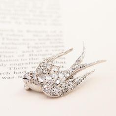 A rare find for the collector out there! Historically given to a loved one to symbolize fidelity and loyalty, swallows also mate for life and always return to the nest so it was also typically gifted to wish for a safe return home after a journey.This one is elegant in its silhouette, and can actually be strung on a chain beautifully., the old cut diamonds shimmering beautifully as the bird spins and turns.*The jewels appears to have been rhodium plated in the past, and we are happy to strip thi Elegant Bird Design Brooches For Gift, Modern Mens Rings, Art Jewelry Earrings, Swallow Bird, Bespoke Rings, Antique Watches, Bird Brooch, Swallows, Antique Engagement