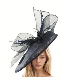 Hats By Cressida Kentucky Derby Ascot Fascinator Hats Black Barn Owl Fascinator Hat Gorgeous extra large navy blue sinamay flat saucer hatinator is trimmed with a black bow and navy blue feathers. This navy blue & black fascinator measures 48cm wide or about 19 inches This headpiece is mounted with a matching headband.   If you prefer a headband to match your hair, please make a note at check out what colour headband you want. Our Barn Owl Saucer Fascinator Hatinator that's perfect for any formal occasion, wedding, horse racing events like the Kentucky Derby, Ascot,Dubai World Cup and Glorious Goodwood.  Featuring an extra large sinamay flat saucer base and sinamay bow, this elegant cocktail hat is ideal for women who want to make a statement at the Epsom Derby,Kentucky Oaks, Preakness or Elegant Navy Wide Brim Hat, Chic High Crown Fascinator, Elegant Navy Hats With Curved Brim, Elegant Navy Hat With Curved Brim, Chic Fitted High Crown Fascinator, Fitted Party Hat With Structured Crown, Fitted Hat With Structured Crown For Party, Fitted Navy Wide Brim Hat, Navy Fitted Wide Brim Hat