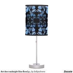 a table lamp with a blue and grey pattern on it's shade is shown