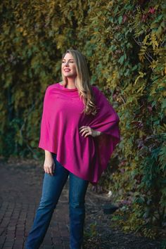 Best Seller! Our favorite poncho is this must have Elsa Bamboo Poncho. It's lightweight with a sweeping asymmetrical hem and the perfect drape. This layering piece is perfect to wear anytime, any season, and any occasion. Whether you're in the mood to wear a bright sherbet tone or a rich Fall tone, we offer a variety of colors that will make it easy to match your style. Details & Care One Size 100% Bamboo fine gauge knit Bamboo fabric offers natural UV protection 24''L X 29''W 32''L from shoulde Versatile Fall Poncho, Pink One-size Poncho For Fall, Pink One Size Poncho For Fall, Rain Poncho, Travel Dress, Magenta Pink, Travel Collection, Poncho Sweater, Bamboo Fabric