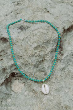 Elevate your beach ensemble with the Elsa Shell Necklace (named after our favourite Ibu). Made from recycled polyester beads, it's a sustainable and stylish choice. Rock it solo or layer it with our Balik Double Beaded Necklace for a vibrant summer vibe. Casual Turquoise Beads For Beach, Blue Strand Necklaces For Beach Season, Bohemian Heishi Beads Jewelry For Summer, Summer Bohemian Heishi Beads Jewelry, Blue Necklaces For Summer Beach, Blue Strand Shell Necklace In Beachy Style, Handmade Blue Beaded Necklaces For Beach, Adjustable Blue Shell Necklace For Summer, Summer Beaded Strand Chain Jewelry