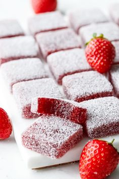 strawberry shortbreads with powdered sugar and fresh strawberries on the side, ready to be eaten