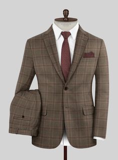 Make a bold statement and let your style speak volumes with our London Loom Brown Check Wool Silk Linen Suit. Expertly tailored from a premium wool blend, it features a striking plaid design in brown with a touch of wine, creating a unique and eye-catching appearance. The fabric guarantees maximum comfort while maintaining elegance, allowing you to confidently shine at any event. Whether attending a wedding, stepping out for a formal day, or simply showcasing your fashion sense, this suit exemplifies sophisticated charm in your wardrobe.  The London Loom Collection  masterfully blends the durability of wool, the luxury of silk, and the breathability of linen, reflecting the elegance of English tailoring. This fabric offers season-spanning comfort, refined drapes, and natural coolness. Wove Semi-formal Fall Plaid Suit, Fall Semi-formal Plaid Suit, Plaid Wool Suit With Notch Lapel, Timeless Fitted Plaid Outerwear, Plaid Suit For Business Casual In Fall, Plaid Business Casual Fall Suit, Semi-formal Plaid Wool Suits, Brown Suit For Business Casual In Fall, Brown Fitted Suit For Work