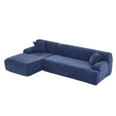 a blue sectional sofa with pillows on it's back and the seat folded out