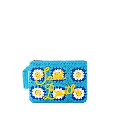 a crocheted blue purse with the words sun and flowers on it, in gold lettering