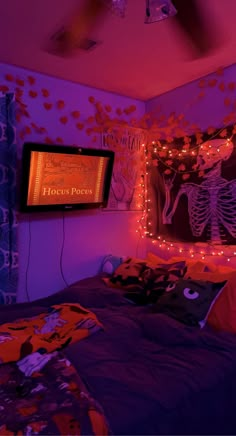 a bedroom with purple and orange lights on the walls