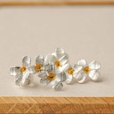 "These tiny flower stud earrings are exquisite and suitable for matching with a dress and skirt. They are also a great fit for matching with simple and casual outdoor wear. Keep your style simple and yet trendy with our flower earrings. This is all you need for that picnic out in the fields, a first dinner date or an evening out with friends. It can also be the perfect accessory for that business outfit or an impromptu meeting with the boss. MATERIAL Sterling Silver SHIPPING Your order will ship Orchid Earrings, Flower Earrings Gold, Gold Orchid, Antique Silver Jewelry, Silver Flower Earrings, Flower Earring, Flower Stud Earrings, Spring Gifts, Gift For Her Birthday