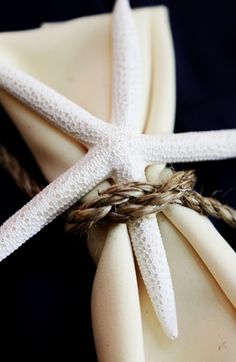 a white starfish tied to a napkin