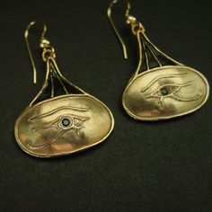 "Ancient Egypt eye of Horus earrings hand carved. The Eye of Horus is an ancient Egyptian symbol of protection, royal power, and good health. The Eye of Horus is similar to the Eye of Ra, which belongs to a different god, Ra, but represents many of the same concepts. The eye of Horus was often used to symbolise sacrifice, healing, restoration, and protection. Funerary amulets were often made in the shape of the Eye of Horus. The symbol \"was intended to protect the pharaoh in the afterlife\" and to ward off evil. Ancient Egyptian and Middle-Eastern sailors would frequently paint the symbol on the bows of their vessels to ensure safe sea travel. Horus was the ancient Egyptian sky god who was usually depicted as a falcon. His right eye was associated with the sun god, Ra. The eye symbol repr The Eye Of Ra, Egypt Eye, Sky God, Egyptian Earrings, Ancient Egyptian Jewelry, Ancient Egyptian Symbols, Sapphire Eyes, Eye Of Ra, Sea Travel