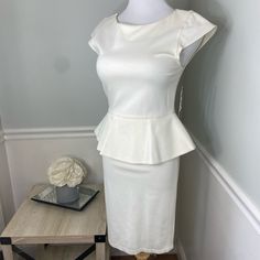 Nwt Alice + Olivia Peplum Dress. Cream Colored With Silk Lined Peplum. This Dress Has Not Been Worn But Has Some Imperfections That I Tried To Point Out In The Pictures Including A Minor Pull And Dirt (Can Probably Be Washed Out) On The Hem. Priced Accordingly. Labeled Size 10 But Fits More Like A 4/6. White Peplum Dresses With Ruffles, White Peplum Dress With Ruffles, Elegant Peplum Mini Dress For Brunch, Fitted Peplum Dress For Brunch, Fitted Peplum Mini Dress For Brunch, Feminine Fitted Peplum Dress, Elegant Peplum Midi Dress For Summer, Elegant White Peplum Dress, Formal Summer Peplum Midi Dress