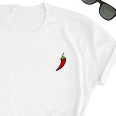 Chilli Beans Shirt, Chilli Shirt, Chilli t-shirt, Chilli Lover Gift, Spicy Minimalisti Shirt, Mexico Tee, Mexico Lover Unisex T-shirt You will fall in love with this unisex t-shirts, they feel soft and lightweight with the right amount of stretch, super confortable and flattering for both men and women. - 100% pre-shrunk cotton - Weight: 5.0 oz - Shoulder to shoulder tapping - Side-seamed Time for delivery - Processing and production time 1 to 6 business days (usually 2-3 days) - U.S Shipping ti Casual Crew Neck Top For Gift, Casual Crew Neck Top As A Gift, Casual Crew Neck Top Perfect For Gift, Casual Tops With Funny Print For Gifts, White Casual T-shirt As Gift, White Casual T-shirt As A Gift, Casual White T-shirt As A Gift, Casual Short Sleeve Tops As Gift, Casual White Shirt As Gift