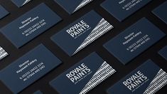 rows of business cards with the name royal paints printed on them, all in white and blue