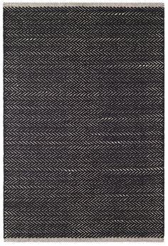 a black and white rug with herrings on it