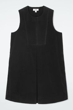 The COS womenswear team looked to the '70s when designing this mini dress. It's crafted from velvety cotton-corduroy that adds depth to the black hue and features a bib front, box pleat and a split neckline. Regular fitButton closureSide-seam pockets Shell: 100% Cotton. Excluding trims / Machine wash Back length of size 6 is 34.25" / Model wears a size 6 Belted Shirt Dress, Women Magazines, Short Shirts, Pleated Mini Skirt, Linen Shirt, Mini Black Dress, Day Dresses, Jacket Dress, Jumpsuit Dress