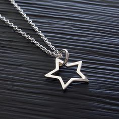 "Sterling Silver Star Pendant Outline Necklace, Patriotic Star Necklace, Celestial Zodiac Star Jewelry, Lucky Star Birthday Charm Necklace, FREE SHIPPING Brilliant and high polished, this 925 sterling silver star pendant necklace has a simple open work design. Choose from several chain options to make it special gift to give or a versatile accessory for yourself. OVERVIEW: * Beautiful, elegant, bright and sturdy 14, 16, 18, 20, or 22 inch 925 sterling silver chain. Choose from a 0.7 mm 925 sterl Star-shaped Charm Necklace For Gift, Star Charm Necklace As Gift, Star Charm Necklace Gift, Personalized Star Necklace For Birthday, Star Charm Necklace For Gift, Personalized Star Necklaces For Birthday Gift, Personalized Star Necklace For Birthday Gift, Silver Star-shaped Jewelry For Birthday, Silver Star-shaped Birthday Jewelry