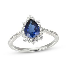 Elegant yet eye-catching, this lab-created gemstone ring is a beautiful surprise for her September birthday or just because. Crafted in sterling silver A pear-shaped blue lab-created sapphire is surrounded by white lab-created sapphires in varied sizes, creating a scalloped silhouette More white lab-created sapphires sparkle on the slender shank Sterling Silver Pear-shaped Ring With Halo Setting, Pear-shaped Sterling Silver Ring With Halo Setting, Sterling Silver Teardrop Jewelry With Center Stone, Teardrop Halo Setting Promise Ring, Sterling Silver Pear-shaped Ring For Anniversary, Sterling Silver Pear Shaped Ring For Anniversary, Fine Jewelry Pear-shaped Sapphire, Fine Jewelry Teardrop Ring With Accent Stones, Pear-shaped Sterling Silver Anniversary Ring