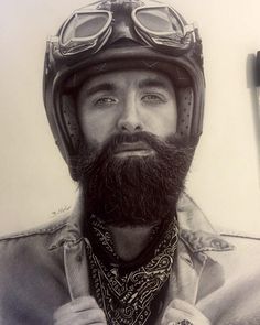 a black and white photo of a man with a beard, wearing a motorcycle helmet