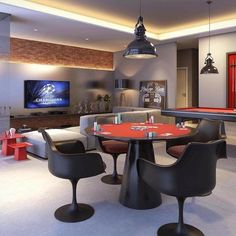 a billiards table and chairs are in the middle of a room with pool tables