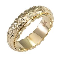 a gold wedding ring with an intricate design on the outside and inside, set in 18k yellow gold