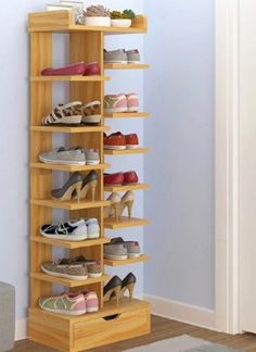 a wooden shoe rack filled with lots of shoes