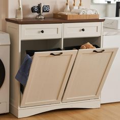 PRICES MAY VARY. High Quality: 39.76"L x 13.58"W x 38.58"H trash can cabinet (trash can not included). Made of MDF, the tilt out trash cabinet which fits up to 2 x 13 gallon trash can. You can put microwave, coffee maker or anything you want on the tabletop. Multifunctional Design: The trash cabinet is not only a practical kitchen trash can but it can also be used as the laundry basket or recycling bin, as well as a pet food bin. The drawers provide the convenient storage space for small sundries. Modern Trash Cabinet: Tilt out trash cabinet is simple and practical. It can be easily incorporated into a variety of decorating styles. It will be perfect for dressing up your kitchen, home, apartment, dorm room, etc. It also can be used as a kitchen island or suitable to store dog food, cat foo Kitchen Island With Tilt Out Trash Can, Double Tilt Out Trash Can, Island With Trash Can Storage, Creative Dog Food Storage Ideas, Trash Furniture, Kitchen Trash Can Ideas, Ikea Trash, Dog Food Storage Ideas, Trash Bin Cabinet