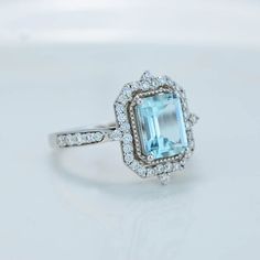 The default design option features 9x7mm Emerald Cut Aquamarine, VVS1-Clarity, VG-Cut, Ex-Polish, VG-Symmetry Set D-Colorless Moissanite Accent Stones in 14K White Gold Engagement Ring. Model 587-9x7mm Also you can fully customize and engrave this ring by clicking the button "Personalize in 3D". - As well please remember it takes up to 19-21 days to make and ship this item. Emerald Cut Aquamarine Topaz Ring For Wedding, Emerald Cut Topaz Wedding Ring With Aquamarine, Aquamarine Gemstone Octagon Rings, Octagon Aquamarine Gemstone Rings, Emerald Cut Light Blue Jewelry For Weddings, Light Blue Emerald Cut Wedding Jewelry, Light Blue Emerald Cut Jewelry For Wedding, Gia Certified Aquamarine Wedding Jewelry, Aquamarine Octagon Wedding Ring