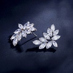 A delightfully unique pair of bridal earrings with an incredible sparkle! Adorned with flawlessly faceted cubic zirconia that capture the light in a dazzling array of sparkles, the earrings are rhodium plated for a bright finish which enhances the intricate detailing and conveys a modern take on old elegance. The earrings are 1" (approx. 2.5cm) in length and come with sturdy backs. Available in Silver, Rose Gold and Yellow Gold finishes. To make your choice select your preferred finish from the Dazzling Diamond White Crystal Earrings, Elegant Diamond White Crystal Cluster Earrings, Formal Sparkling Diamond White Cluster Earrings, Elegant Sparkling Crystal Cluster Earrings, Sparkling Dazzling Crystal Earrings, Sparkling White Gold Cluster Earrings With Cubic Zirconia, Sparkling White Gold Cubic Zirconia Cluster Earrings, Elegant Sparkling Cubic Zirconia Cluster Earrings, Formal Crystal Cluster Earrings With Sparkling Stones