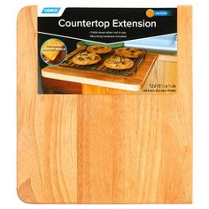 a wooden cutting board with an ad for countertop extension on the front and side