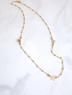 This simple little necklace is so flattering and versatile.  It’s beautiful on its own and also looks great as a layering necklace.   It features three small 14kt gold filled star charms spaced out on the chain. The stars are hammered with a dappled texture to catch the light.  The stunning chain is a 14kt gold filled bead chain. It is finished with a spring ring clasp and my signature large end ring. It has an extender to make the length adjustable to 16-18”. Delicate Everyday Necklace With Star Charm, Dainty Star Charm Necklace For Everyday, Dainty 14k Gold Filled Star Charm Necklaces, Dainty 14k Gold Filled Star Charm Necklace, Dainty Star Necklace For Everyday Wear, Dainty Star-shaped 14k Gold-filled Necklace, Dainty 14k Gold-filled Star Necklace, Dainty 14k Gold Filled Star Necklace, Opal Bangle