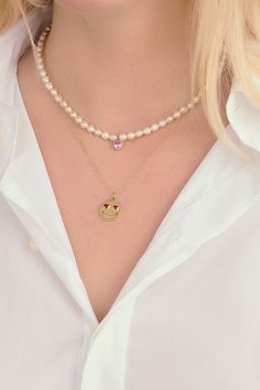 Show your love. Our Lover Pearl Necklace features a single bezel set heart shaped gemstone in the color of your choosing strung onto a strand of freshwater pearls with a 14K Yellow Gold clasp closure. The ruby, emerald & sapphires are lab created stones. Yellow Gold Heart Jewelry With Pearl Charm, Heart-shaped Yellow Gold Jewelry With Pearl Charm, Yellow Gold Heart Necklace With Pearl Charm, Yellow Gold Heart-shaped Necklace With Pearl Charm, Dainty Heart-shaped Pearl Chain Jewelry, Pearl Heart Pendant Jewelry With Heart Charm, Valentine's Day Pearl Necklaces With Round Beads, Valentine's Day Pearl Chain Jewelry, Pearl Jewelry With Heart Charm And Round Beads