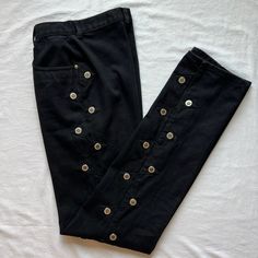 - Labeled as "Slim Fit sz 5" - High waisted - Mom jean fit up top with straight leg  - Dramatic waist to hip ratio - Extra long inseam - would be great for someone tall, or could easily be hemmed.  - Double sided metal buttons/studs all the way up the outseams  - Bareback (no back pockets)  - 100% cotton denim They are in very good vintage condition. Have been washed, which has worn away the coating on the back patch. Everything else is intact. There are lightened crease marks/fold lines, just looks worn in.  Waist: 25.5" Hips: 40.5" Front rise: 11.5" Inseam: 34"  Leg opening: 14.5" circumference Fitted Jeans With Button Zip Fly For Streetwear, Fitted Punk Jeans In Dark Wash, Black Fitted Rigid Denim Jeans, Fitted Punk Style Denim Jeans, Fitted Dark Wash Punk Jeans, Punk Style Fitted Dark Wash Jeans, Black Denim Pants With Button Closure, Fitted Streetwear Bottoms With Button Zip Fly, Black Fitted Rigid Denim Pants