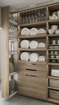 an open cabinet filled with dishes and plates