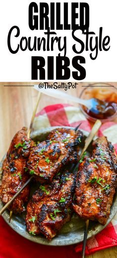 grilled country style ribs on a plate with bbq sauce in the background and text overlay that says grilled country style ribs