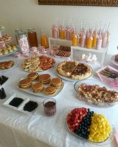 a birthday brunch is set up on a table with desserts and drinks