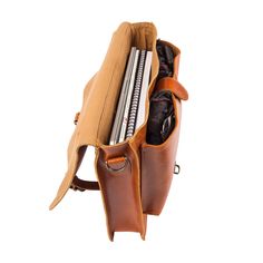 Materials: 100% English Saddle leather exterior. 100% cotton lining interior. Dimensions: 8L capacity. W37cm x H28cm x D8cm, top handle: H4cm W3cm, extendable shoulder strap: L78cm-L145cm. Hardware: Brass fittings and robust YKK zippers. Features: 15″ laptop capacity, extendable detachable shoulder strap, top handle, back zip pocket, internal zip pocket, front leather pouch style pocket, buckle fastening to the main compartment. The classic Messenger in our new Tan English Saddle Leather makes f Classic Leather Trim Crossbody Satchel, Classic Crossbody Satchel With Leather Trim, Classic Office Shoulder Bag With Leather Trim, Classic Shoulder Bag With Leather Trim, Office Satchel With Leather Trim In Crossbody Shape, Business Bags With Leather Trim And Flap, Classic Flap Shoulder Bag With Leather Trim, Classic Saddle Bag With Leather Trim Satchel Shape, Business Satchel Shoulder Bag With Leather Trim