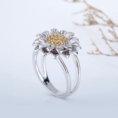 What a beautiful sunflower ring! Sunflowers are known for being “happy” flowers, making them the perfect gift to bring joy to someone's (or your) day. Its outstretched petals are like sun rays bursting with charm and elegance. Because of its likeness to the sun, sunflower symbolize adoration, loyalty and longevity. Dainty and delicate, this ring suits your feminine style. Carat Weight: 0.108 ctStone Size: 1.1 mmStone Type: Jeulia® StoneNumber of Stones: 36 Stone Color: Citrine YellowStone Shape: RoundWeight: 6.4 gWidth: 16.9 mmHeight: 5.8 mmThickness: 3.3 mmMaterial: 925 SilverPlating Color: Silver, Yellow Gold Rings Antique, Sunflower Ring, Black Engagement Ring, Sunflower Jewelry, Being Happy, Michael Kors Jewelry, Vintage Diamond Rings, Happy Flowers, Couple Jewelry