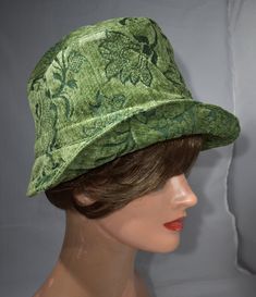 "aI made this  hat  from high end jacquard cotton and rayon chenille fabric of good construction. This hat measures 25 5/8 inches in circumference and is a size Xlarge.My hats look good on all types of hair styles.   Some people wear the hats and headbands high on their head and above the ears; others wear them low on the head and over the tips of the ears. They look great both ways.  21 ½\" - < 22 ½\" is small  22 ½\" - <23 ½\" is medium  23 ½ - <25 is large Measure your head:   Use a tape measure to determine the length, or size in inches. Place the   tape around your head about 1/8\" above your ear, across the mid-forehead, completely circling your head. You may want to measure a little bit over your ear if there is a deeper crown to the hat, or if you are wanting to keep your ears warm Fitted Hat With Short Brim And Lining, Green Flat Brim Bucket Hat For Spring, Green Sun Hat With Curved Brim, Green Sun Hat With Flat Brim, Fitted Green Cotton Hat, Vintage Green Adjustable Hat, Green Flat Brim Bucket Hat, One Size, Fitted Lined Hats With Curved Brim, Fitted Hats With Curved Brim And Lining