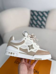 Embrace iconic style and unmatched comfort with these LV Skate-inspired sneakers in a versatile beige colorway. Crafted with meticulous attention to detail, these shoes feature a unique blend of materials, including breathable mesh and luxurious suede, for a sporty and sophisticated look. The signature Louis Vuitton monogram subtly adorns the design, adding a touch of understated luxury. Whether you're hitting the streets or the skate park, these sneakers will elevate your style and keep you loo Fall Winter Jacket, Understated Luxury, Loafer Sneakers, Bottega Veneta Shoulder Bag, Iconic Style, Skate Park, The Streets, White Sneaker, Loafer Shoes