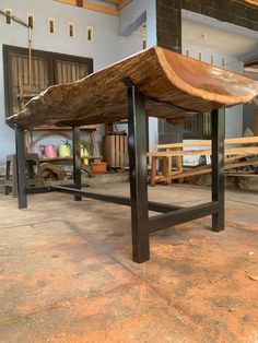 a large wooden bench sitting inside of a building